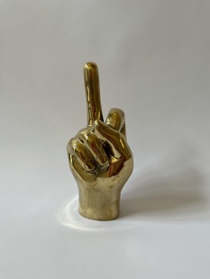 KOVOVÁ RUKA ZLATÁ - SYMBOL